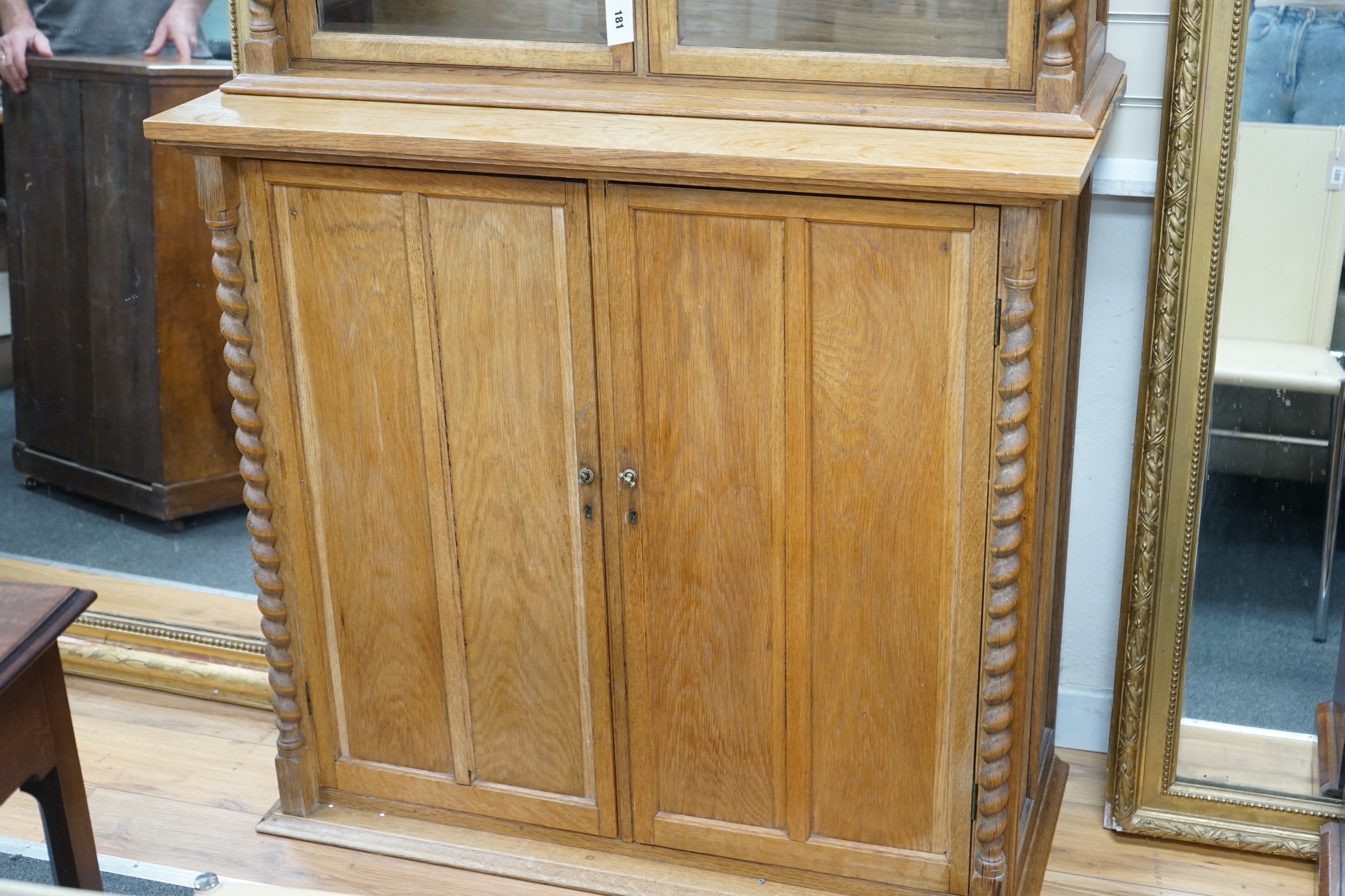 An early 20th century oak three part side cabinet, width 105cm, depth 47cm, height 188cm